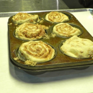 Once you've added the buns to the pan, place in warm area in kitchen and allow them to rise for an hour.