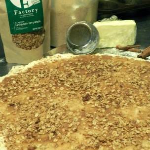 Once the cinnamon sugar is spread on dough, sprinkle with granola.